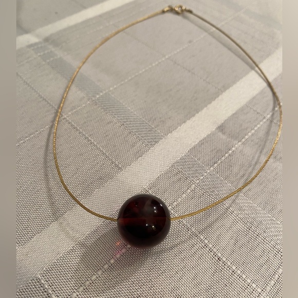 Jewelry - Sophisticated Large Amethyst Sphere adorns this Simple Gold Tone Necklace.
